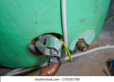 Close Up Of Pipes On A Hot Water Tank