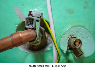 Close Up Of Pipes On A Hot Water Tank