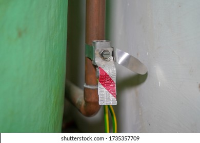 Close Up Of Pipes On A Hot Water Tank