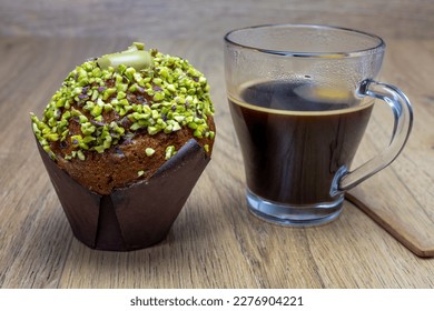 close up of pistachio muffins and cup of espresso on wooden table
 - Shutterstock ID 2276904221
