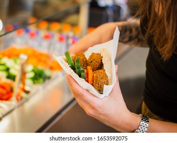 Close Up Of Pita With Falafel In Restaurant At Lunch Time