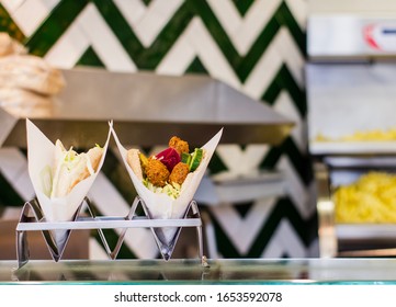 Close Up Of Pita With Falafel In Restaurant At Lunch Time