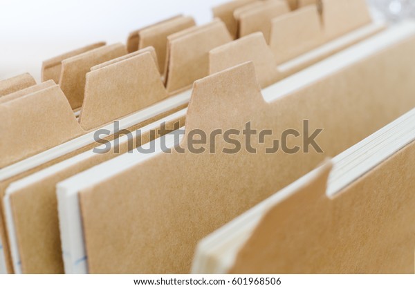 Close up of plain brown index card system\
dividers, left blank to provide copy\
space.