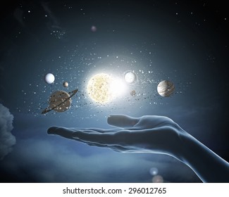 Close up of planet sun system in your hand