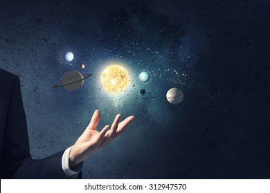 Close up of planet sun system in your hand
