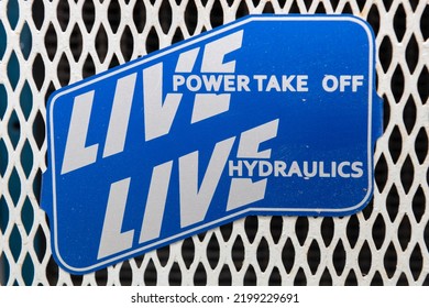 Close Up Of A Plaque Reading Live Power Take Off And Live Hydraulics On A Vintage Tractor 