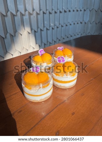 Close up plastic can of Thai Plango (Sweet yellow Marian plum) cheese pie