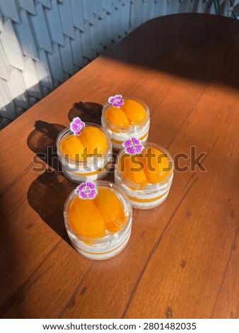 Close up plastic can of Thai Plango (Sweet yellow Marian plum) cheese pie