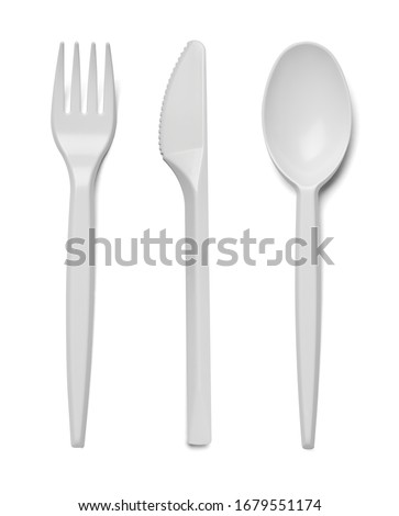 close up of plastic cutlery spoon, fork, knife on white background