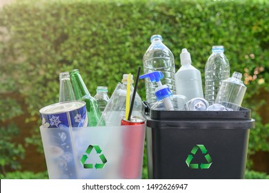 Close up plastic and  glass bottle in the bins for separating recycle materials from the garbages. Reducing waste by following the green concept. Recycling process. - Shutterstock ID 1492626947