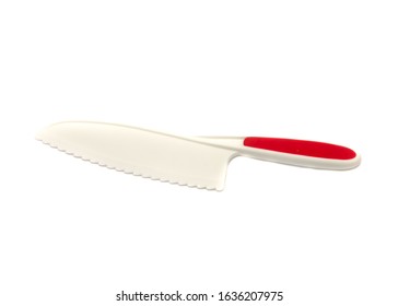 Close Up Plastic Knife With Serrated Blade Isolated On White Background. Bread, Salad Or Lettuce Knives Safe For Kids.