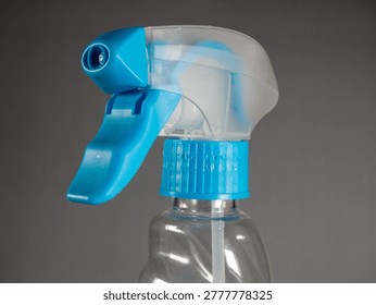 Close up plastic spray bottle trigger mechanism