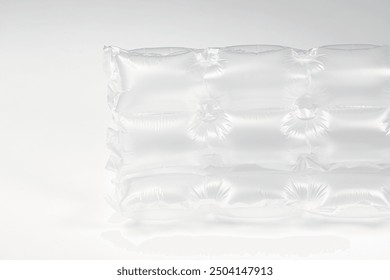 Close up plastic translucent air packaging, Plastic translucent packaging with air cushion. Inflatable air bag isolated on white background.