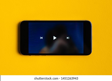 close up play button interface on a modern gadget when watching video