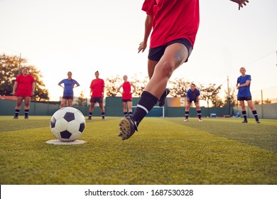 Close Up Of Player Taking Penalty During Womens Soccer Match