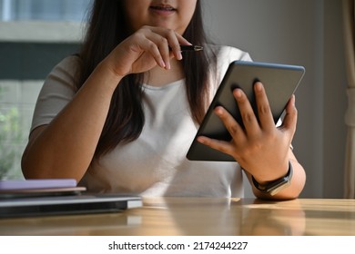 Close Up With Plus-size Lady Overweight Woman Looking At Digital Tablet At Home, Domestic Life Concept.