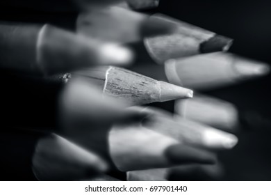Close up of pointed points of a bunch of pencil colors.