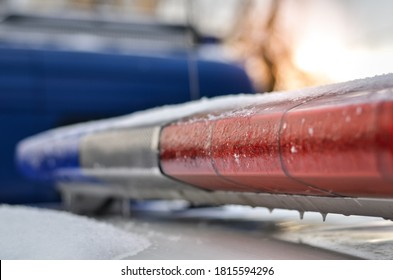 Close Up Of Police Car Light Flasher At Sunset In Winter. Selective Focus. 