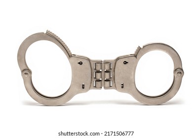 Close Up Of Police Security Steel Metal Handcuffs With Solid Rigid Joint And Different Size Closed Wrist Locks On White Background As Concept For Imprisonment And Arrest