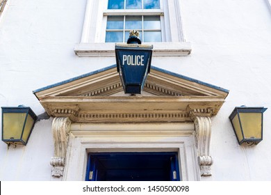 Close Up Of The Police Station In Durham City Centre, England. Blue Police Hanging Sign. Concept For Justice, Police Protection, Criminal, Defence. Space For Copy Text.