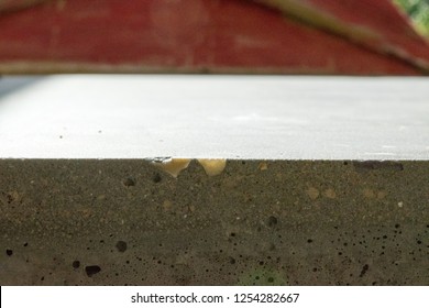 Close Up Of Polished Concrete Worktop Showing Detail Of Colourful Sand And Aggregate Background