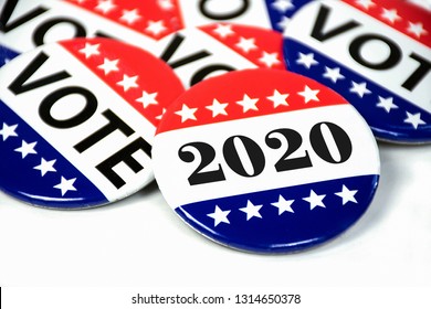 close up of political voting pins for 2020 election on white