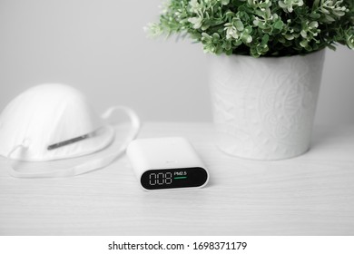 Close Up Portable Air Quality Monitor Detect PM 2.5, The Low Level Is Good Air Quality.