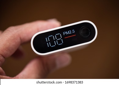 Close Up Portable Air Quality Monitor Detect PM 2.5, The Low Level Is Good Air Quality.