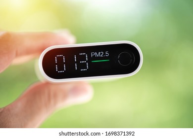 Close Up Portable Air Quality Monitor Detect PM 2.5, The Low Level Is Good Air Quality.