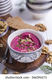 Close up of a portion of beetroot hummus, shallow depth of field, selective focus