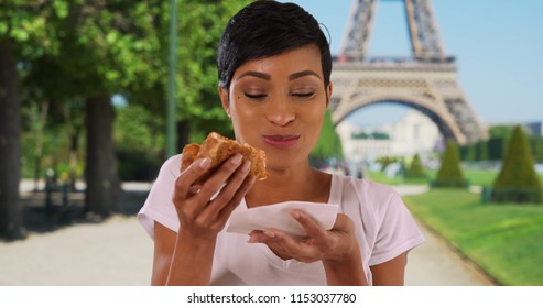 Close Up Portrait Of African American Woman In Paris France Eating Pizza