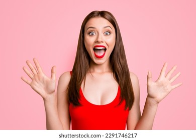 Close up portrait of amazed girl gesturing shock, extremely happy, with wide open eyes and mouth, standing on bright yellow background