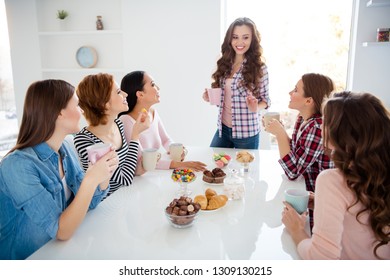 Close Up Portrait Amazing Beautiful She Her Ladies Family Meeting Explain Rules Of Game Stand Sit Round Big White Table In Bright Kitchen Hold Cups Girls Day Night Holiday Indoors