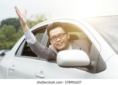 Close Up Portrait Of Angry Pissed Off Young Business Man Pissed Off By Other Drivers And Gesturing With Hands. Road Rage Traffic Jam Concept.