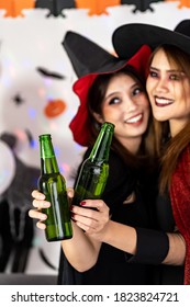 Close up portrait Asian young adult woman wear halloween costume celebrate a Halloween party carnival Festival and cheers with alcohol beer. Halloween celebrate and international holiday concept.