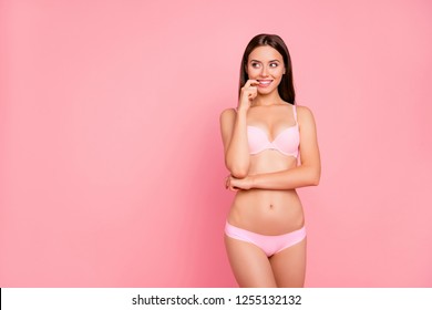 Close up portrait of attractive beautiful gorgeous gentle her she girl with hand near mouth wondering with new prices on cosmetics in pink underwear isolated on pink background looking to empty space
