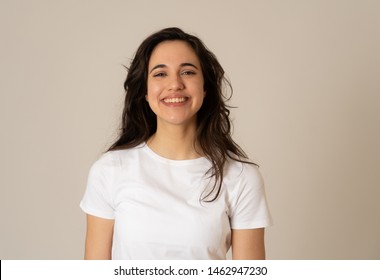 Close Up Portrait Of Attractive Brunette Young Latin Woman With Happy Face Beautiful Smile And Long Black Hair. Isolated On Neutral Background. People, Positive Human Facial Expression And Emotion.