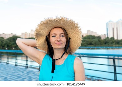 Close Up Portrait Of Attractive Mature Woman In Straw Hat Looking At Camera. Summer Mood. Lifestyle.