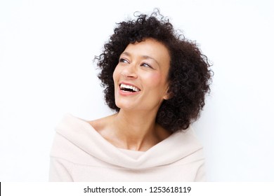 Close Up Portrait Of Attractive Middle Age African American Woman Laughing Against White Background