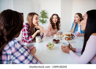 Close up portrait attractive oh no faces beautiful she her diversity ladies sit round white table hold cups hot beverage speak over news friends girls day night holiday indoors - Powered by Shutterstock