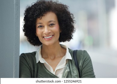 Close up portrait of attractive older african american woman smiling