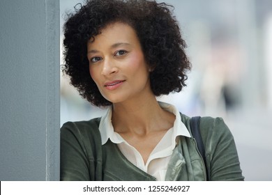 Close up portrait of attractive older african american woman looking at camera