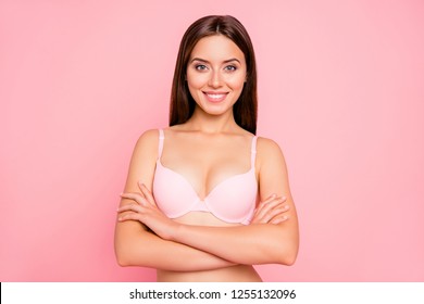 Close up portrait of attractive tenderness gorgeous gentle her she girl with folded hands touching soft fresh shoulders skin gladly looking on camera in pink underwear isolated on pink background