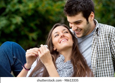 Close up portrait of attractive young  couple in love outdoors. - Powered by Shutterstock