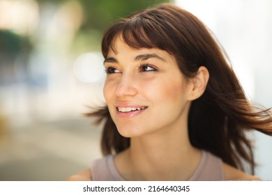 Close Up Portrait Of Attractive Young Woman With Short Brown Hair Looking Away Outside