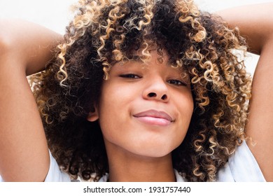 Close Up Portrait Beautiful African American Young Woman With Hands In Curly Hair