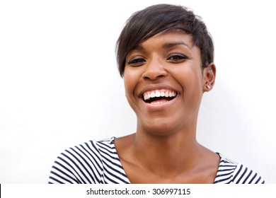 Close up portrait of a beautiful african american woman laughing on white background