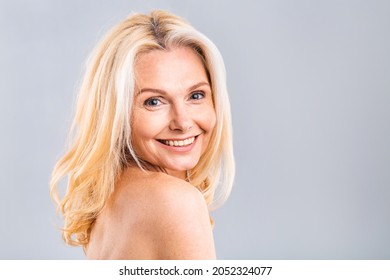 Close up portrait of a beautiful, attractive, charming, naked, nude woman with perfect skin, isolated on white background, after shower, peeling, lotion, mask, wellness, moisturizing concept.