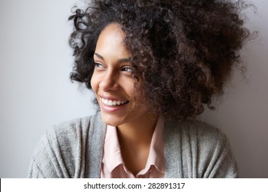 Close Up Portrait Of A Beautiful Black Woman Smiling And Looking Away