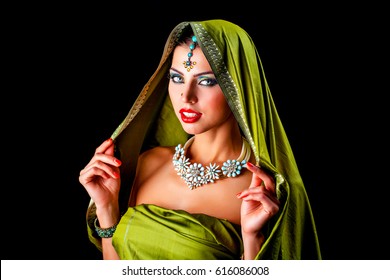 Close up portrait of beautiful eastern woman on a black background